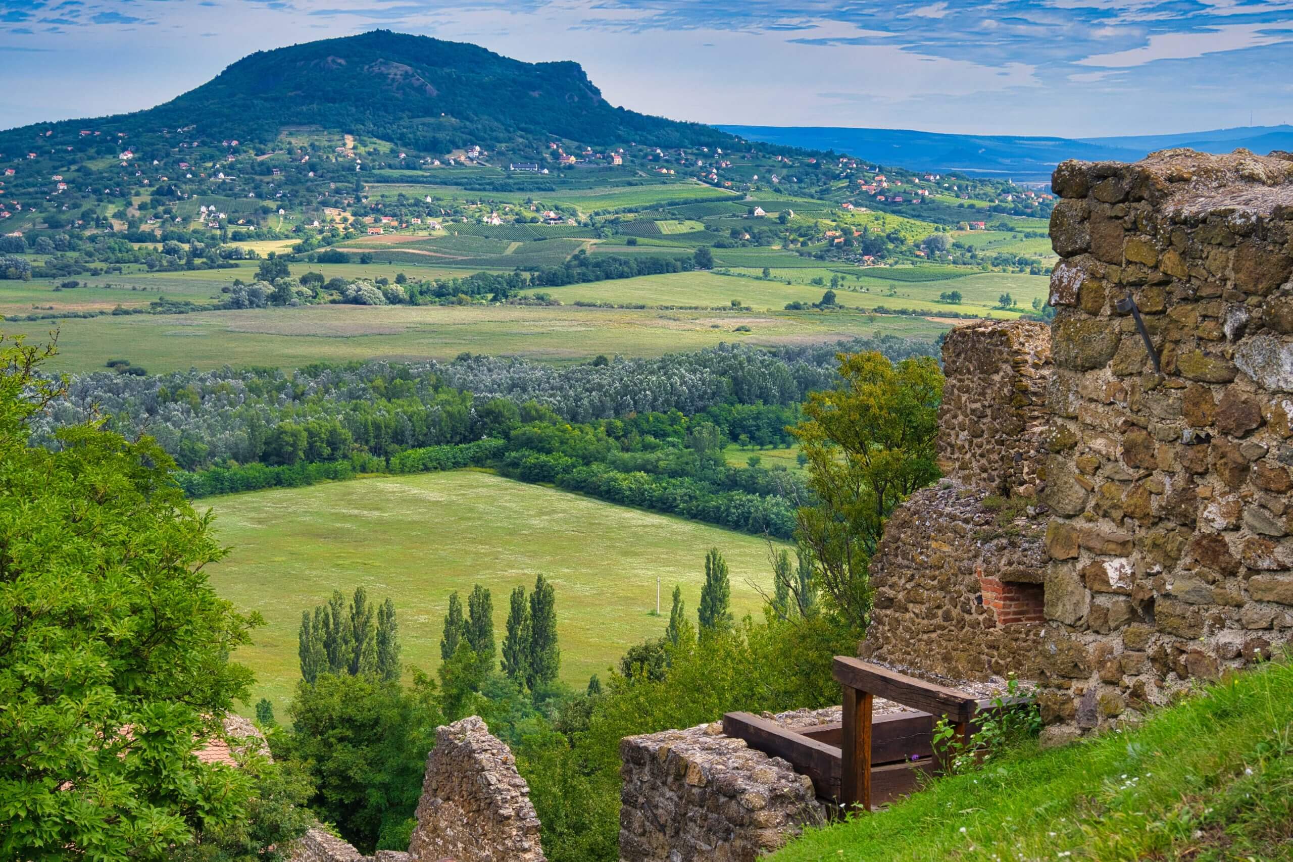 The volcanic basalt hill of Badacsony rising above Lake Balaton vineyards