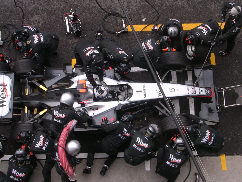 Formula 1 car racing on track at high speed