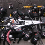 Formula 1 car racing on track at high speed