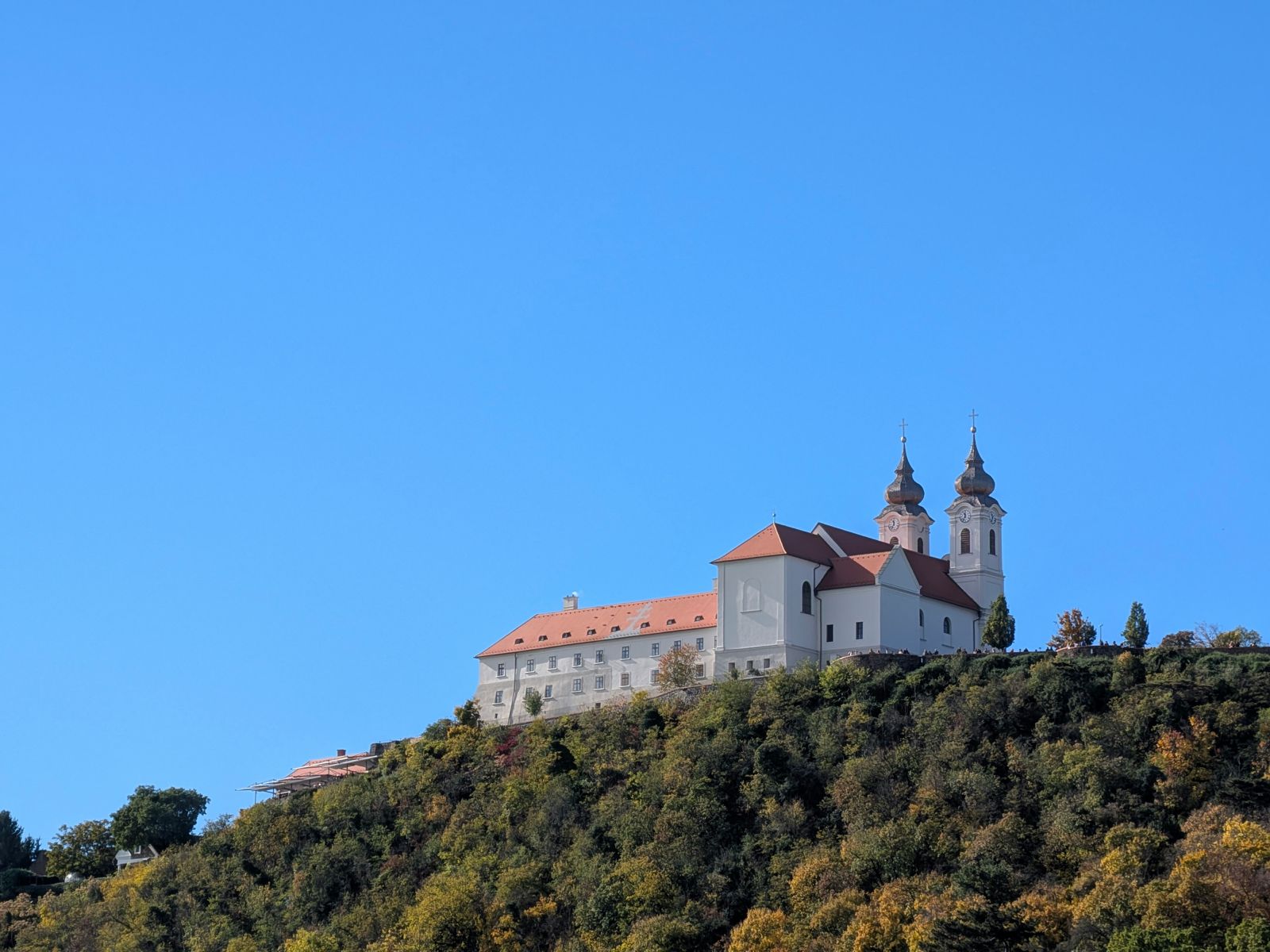 The twin-towered Tihany Benedictine Abbey on its wooded hill above Lake Balaton
