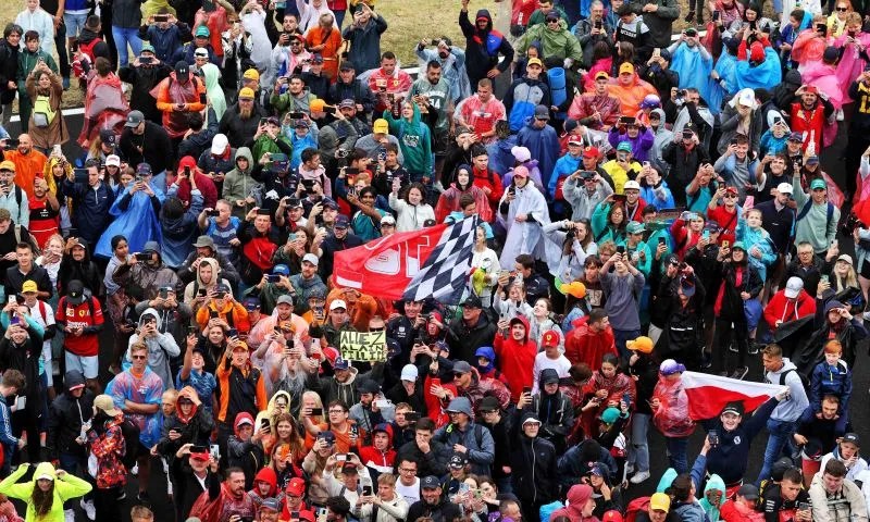 Crowds queueing for public transport on F1 race day