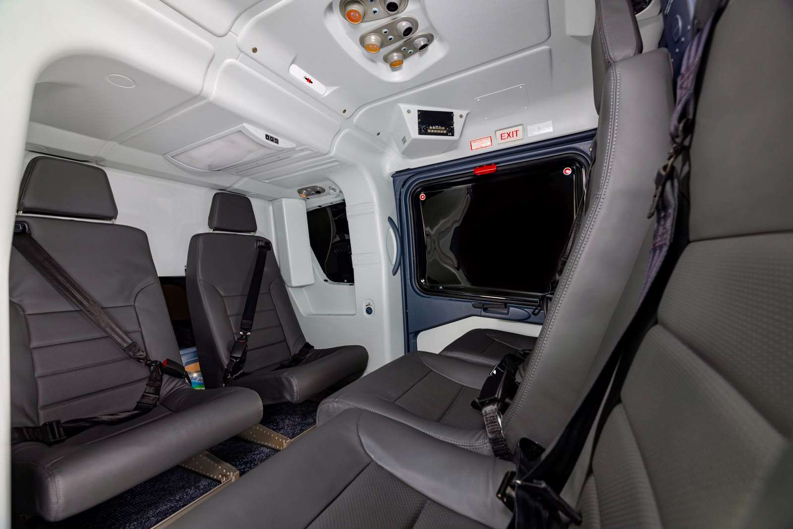 Spacious leather cabin of a private charter helicopter for Budapest Airport transfers